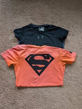 2 Under Armour heatgear girls tshirts size youth medium superman black orange